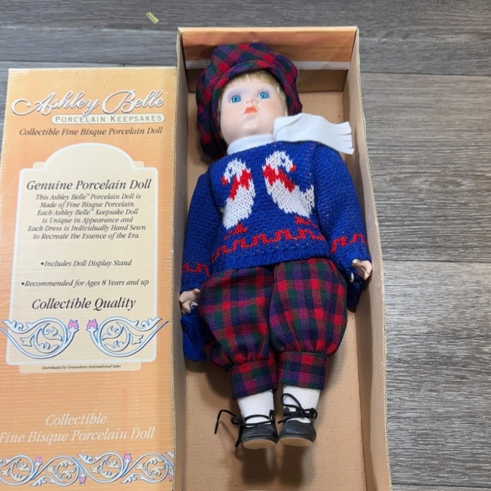 Ashley Belle Porcelain boy Doll with Blue and Red Outfit